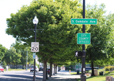 A street with street sign that reads "City County Offices"