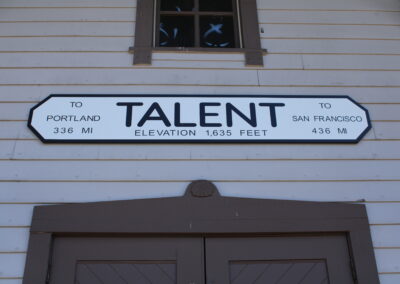 A sign that reads "Talent Elevation 1,635 feet"